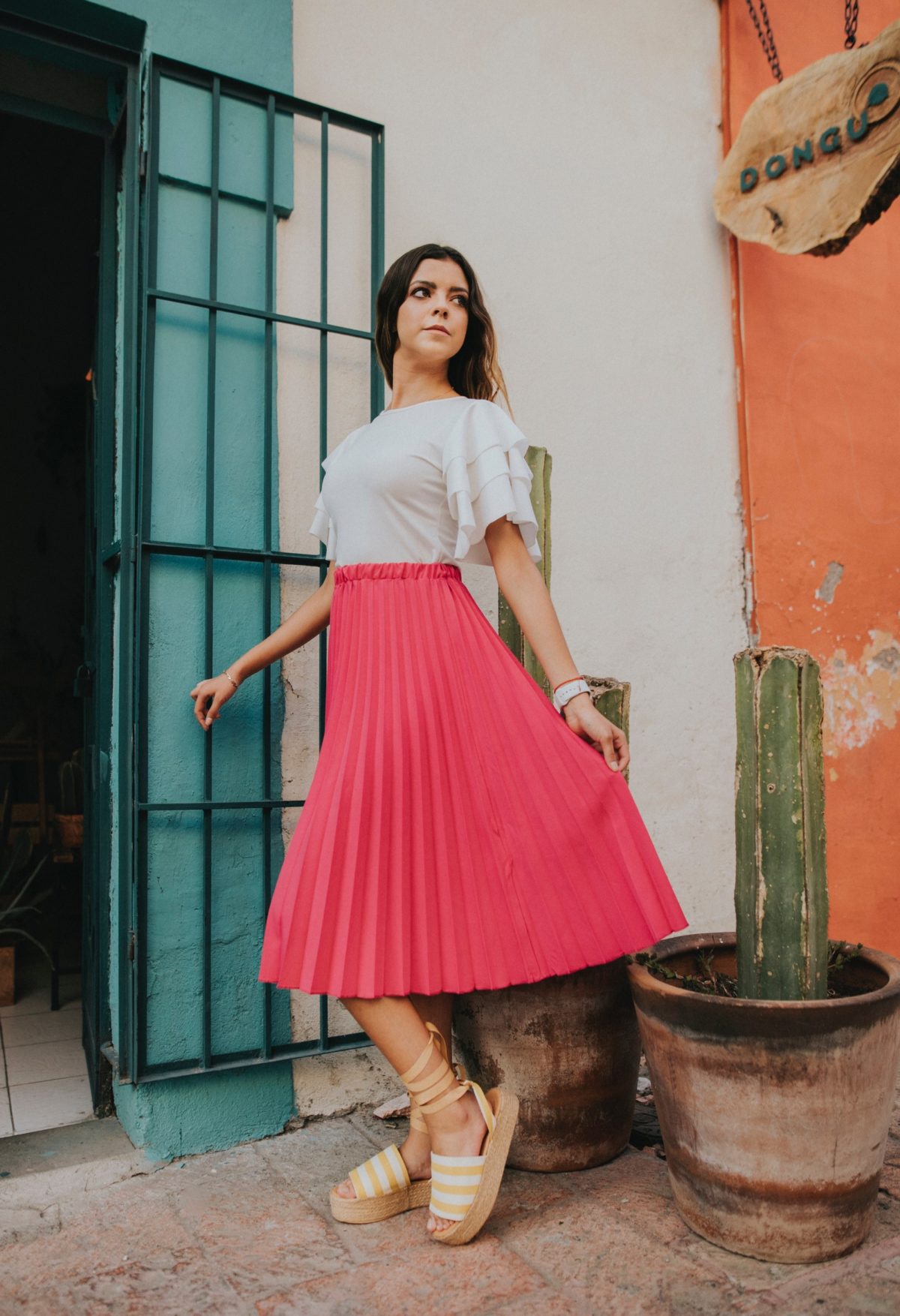 pleated skirt midi outfit for summer with white ruffled top and espadrilles
