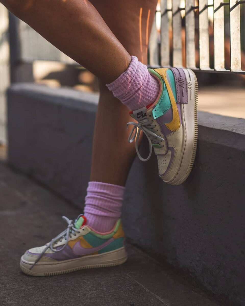 nike sneakers with long purple socks