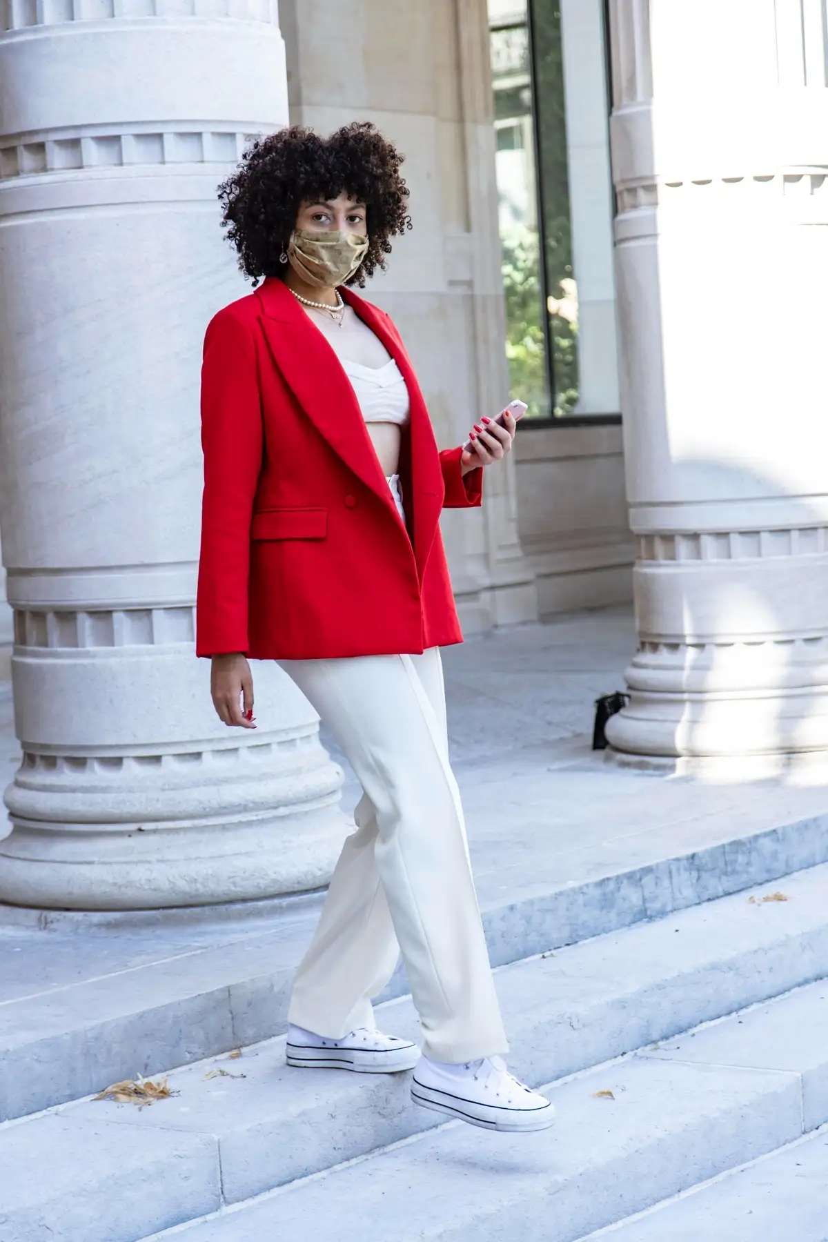 white pants chucks and red blazer outfit