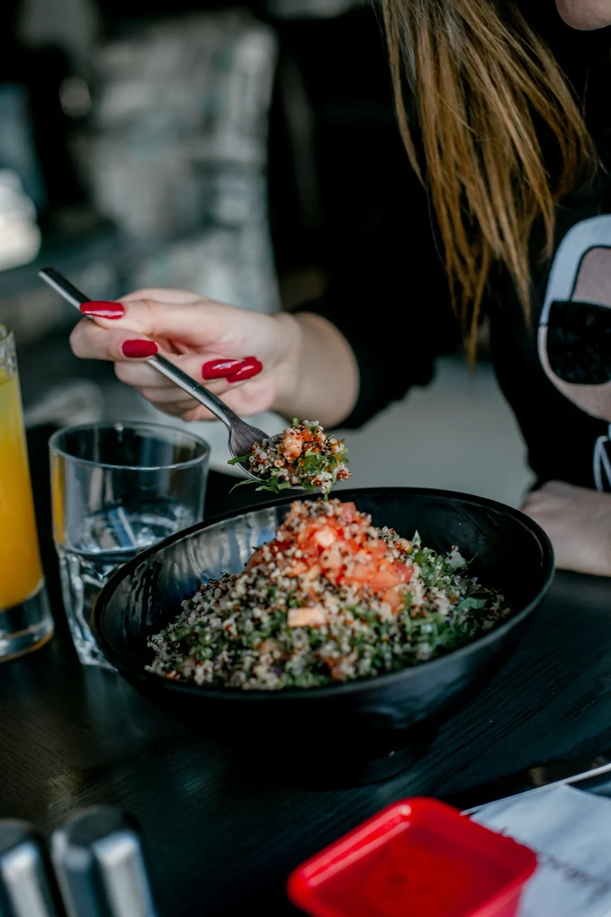 woman eating healthy quinoa salad