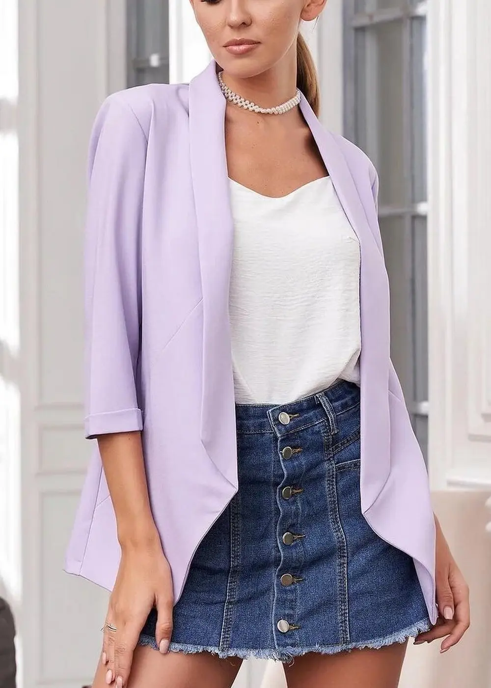 lilac blazer paired with white top and denim mini skirt