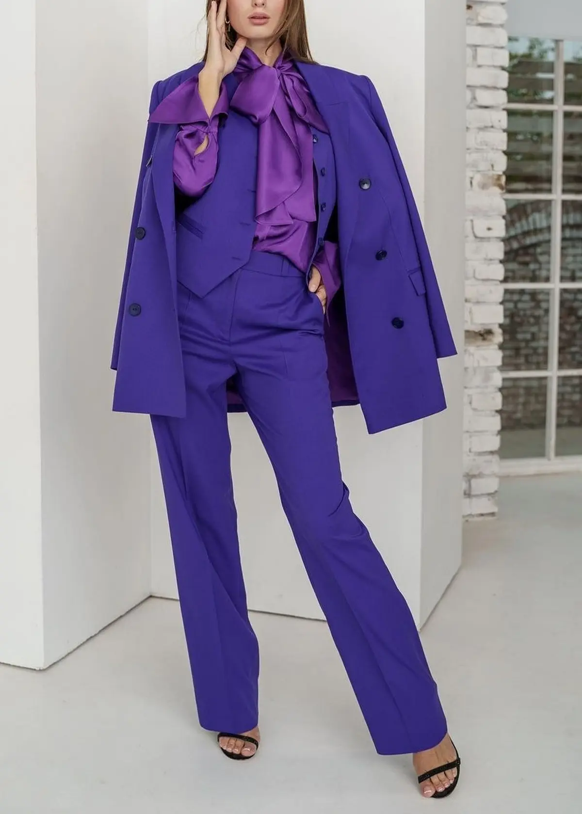dark blue suit paired with purple satin shirt