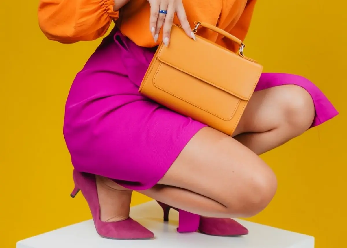magenta skirt paired with orange shirt