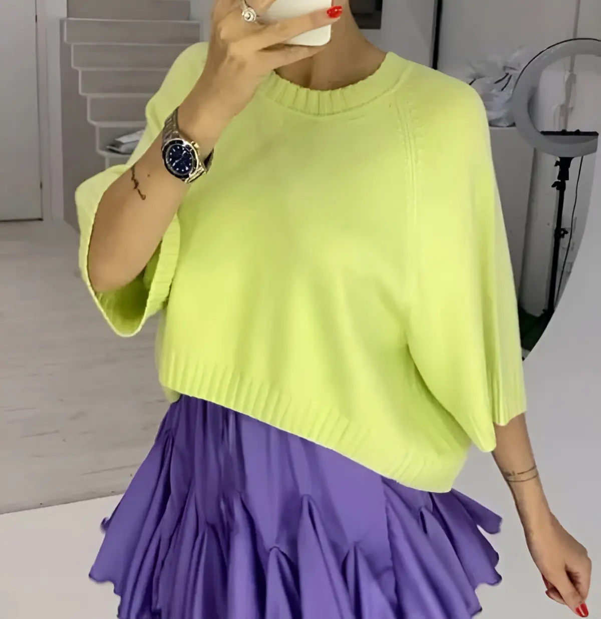 satin purple skirt paired with yellow blouse