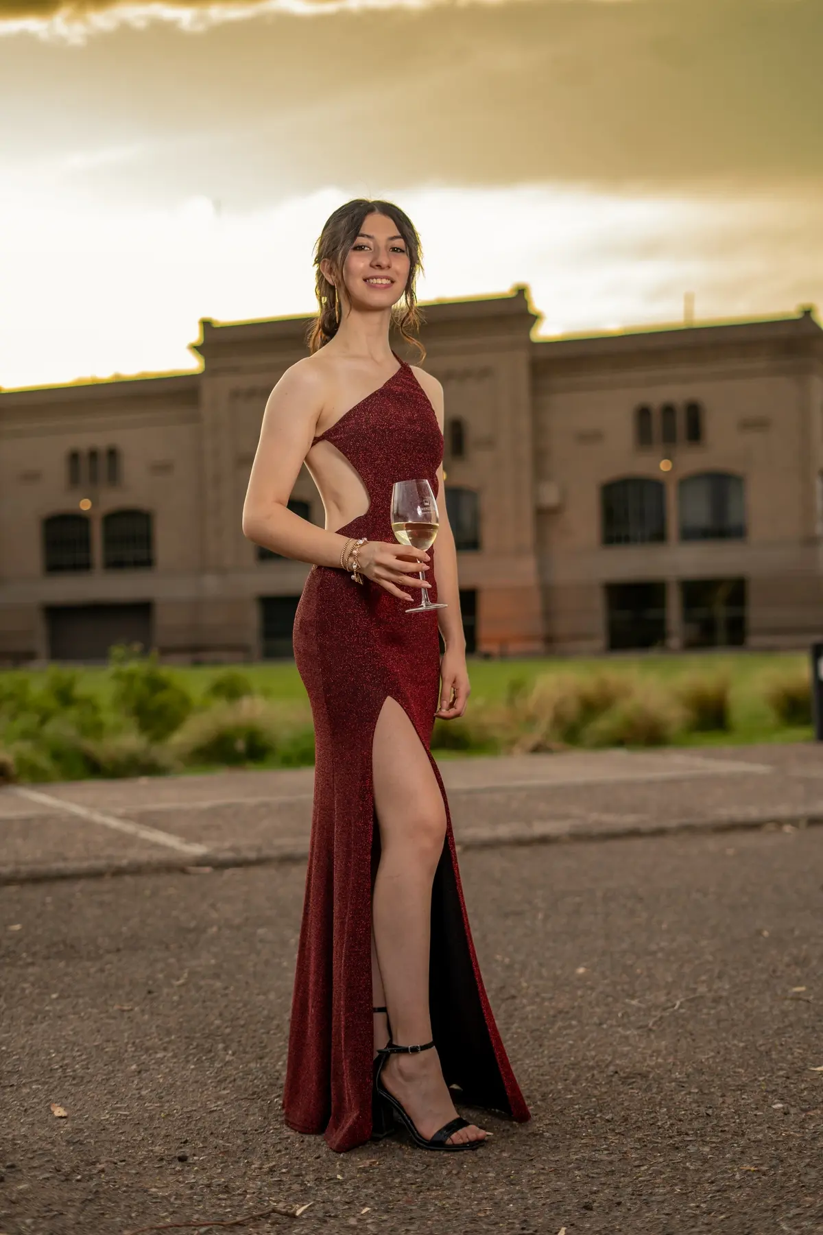 wine red prom dress paired with black high heels