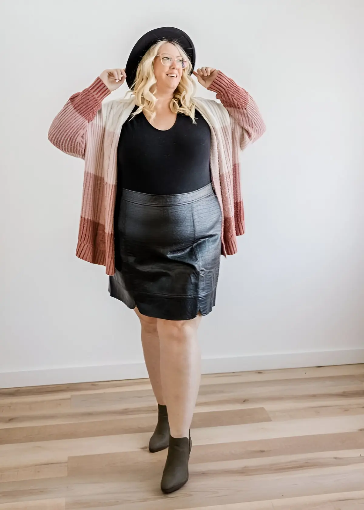 longer cardigan paired with black skirt and top make look thinner