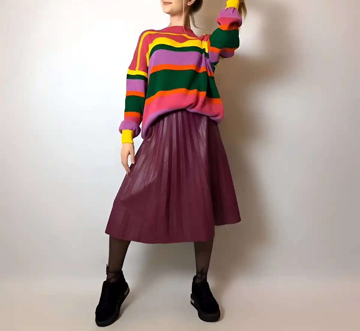 berry leather pleated skirt paired with bright colored sweater