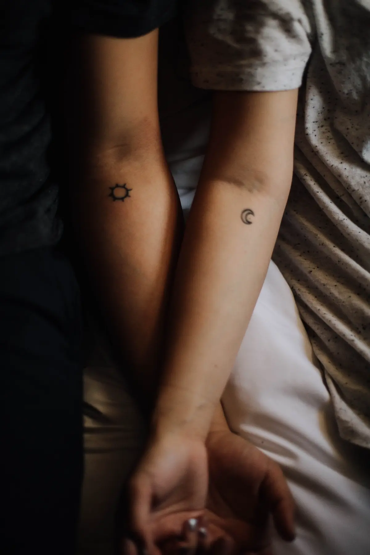 sun and moon matching tattoos on arm inner side