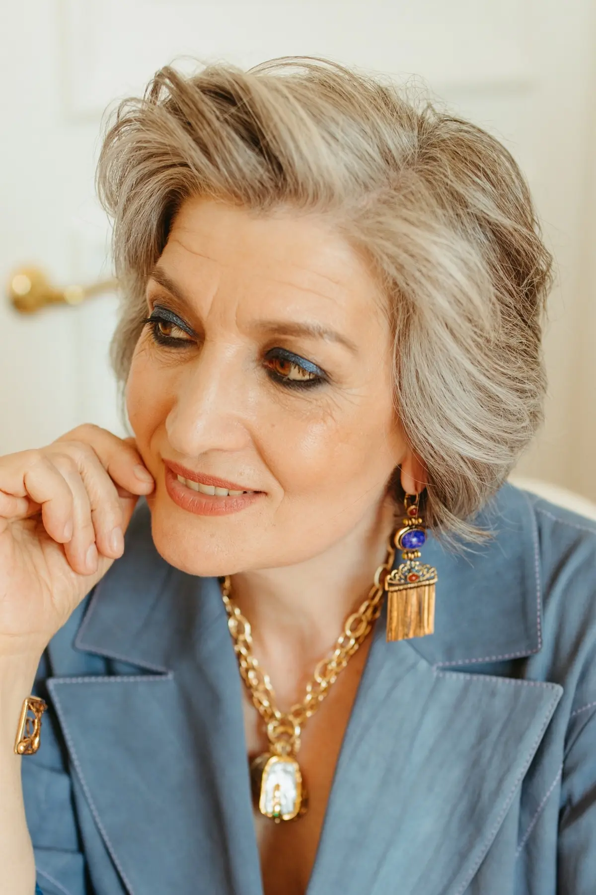 woman over 50 with blue and brown makeup