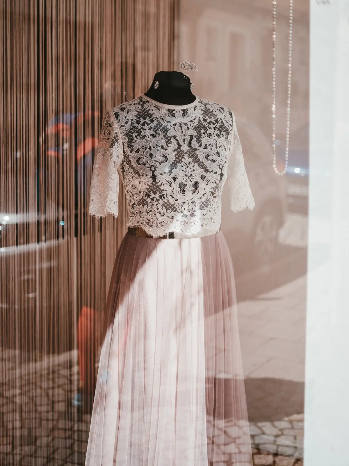 long blush pink pleated skirt paired with lace short top